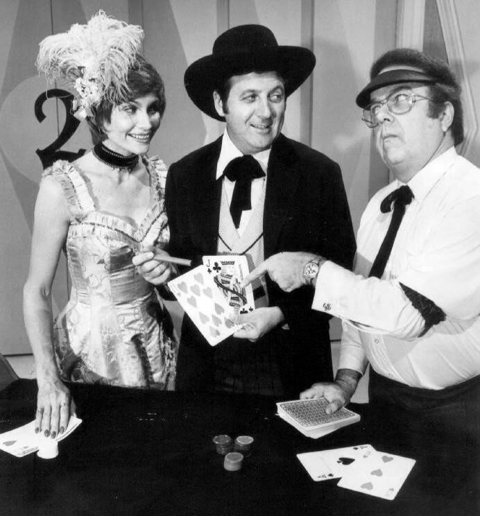Monty Hall, Carol Merrill, Jay Stewart, and contestants on the Let's Make a Deal set in a 1974 publicity photo.